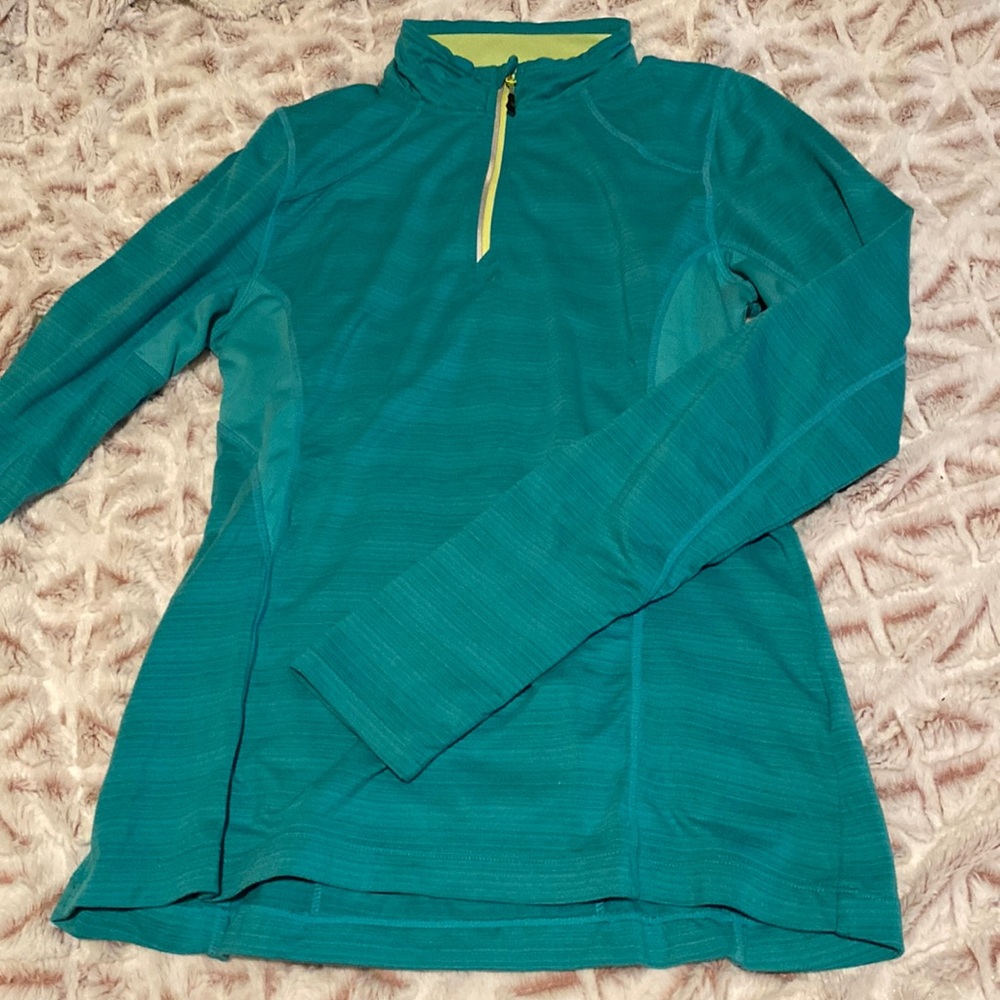 teel long sleeve with thumb holes, 1/4 zip, and back pocket with zipper